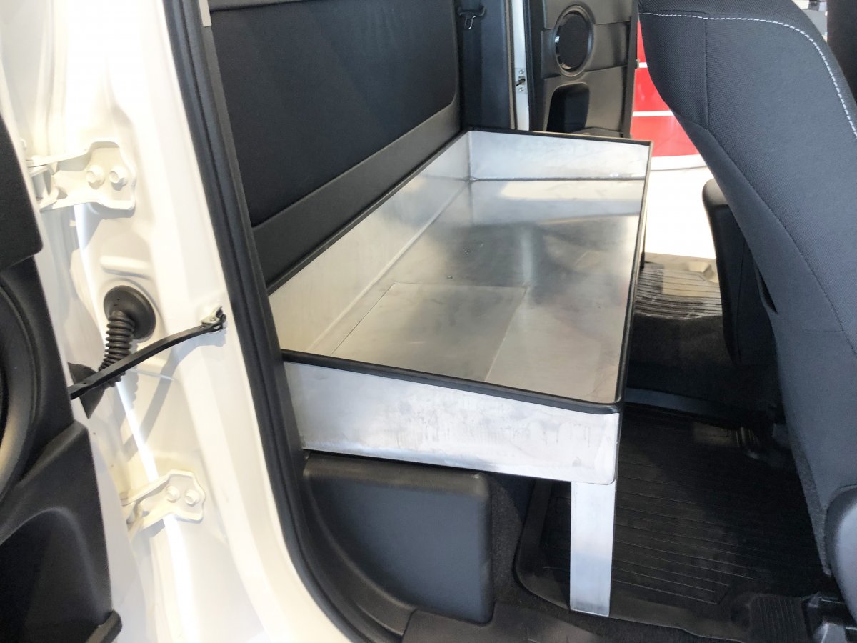 New option : an open aluminum tray fitted in the rear part of the cabin and accessible through the side doors