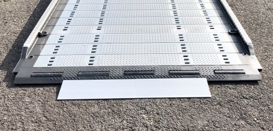 Two small aluminium ramps 700x250 mm with support on equipment for loading vehicles on the platform with trolleys