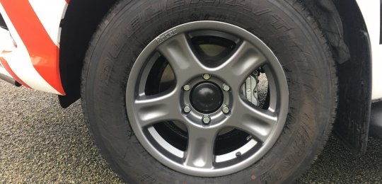 Replacement of the original 4 wheels with ALUMINUM rims reinforced GREY color with tires supply (4 wheels on 4x4)