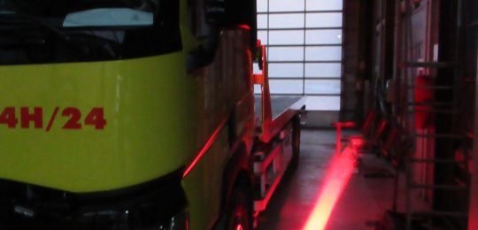 A red LED projector to delimit a safety corridor on the driver's side